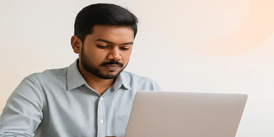 Professional analyzing outsourcing growth data on a laptop