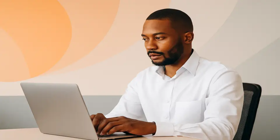 Business professional analyzing outsourcing data on laptop