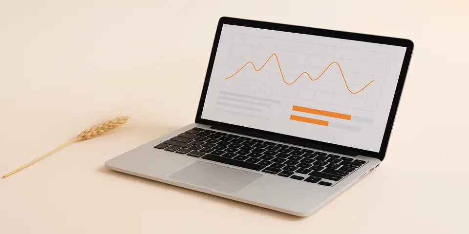 Laptop displaying agricultural analytics and crop data.